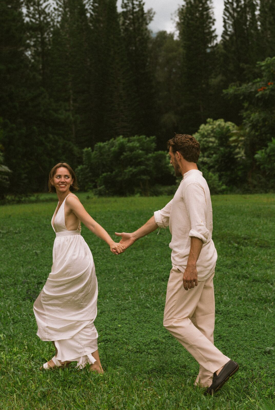 Carley & Tommy — dancing across a green lawn