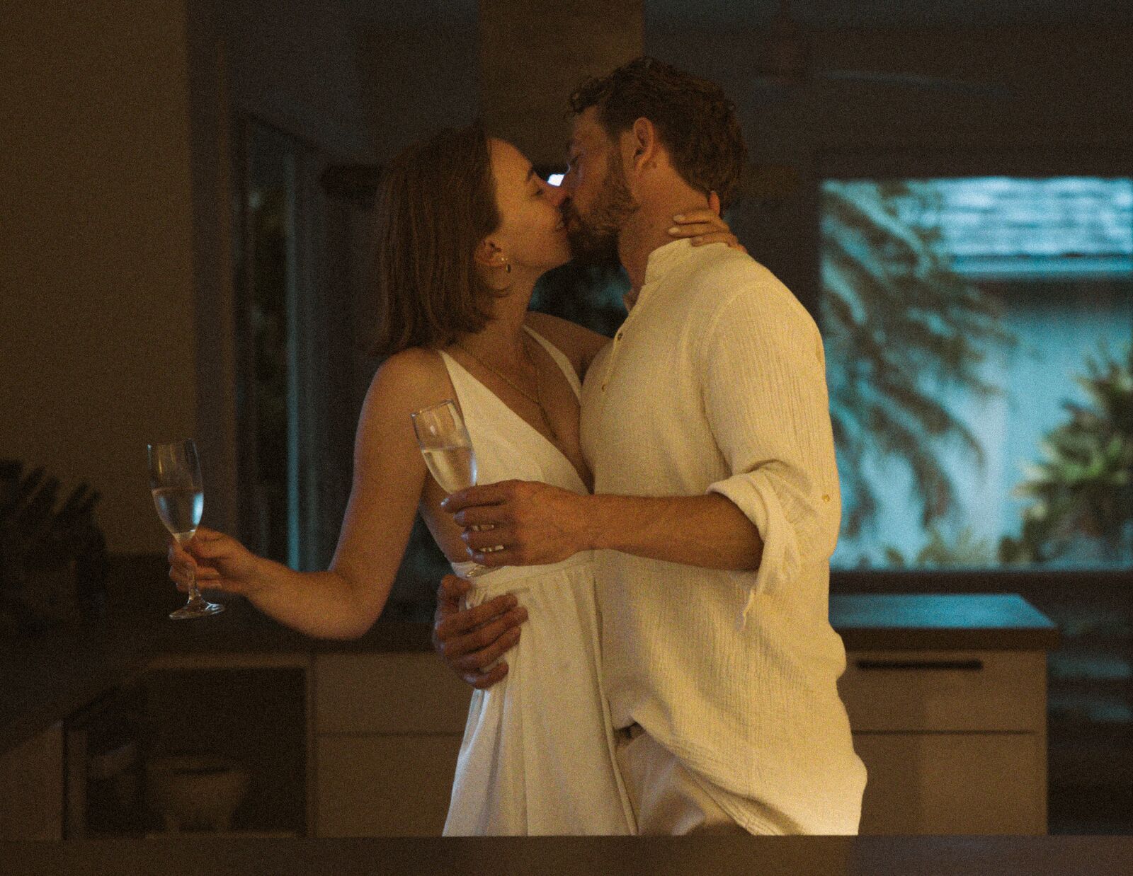 Carley & Tommy — an evening kiss indoors