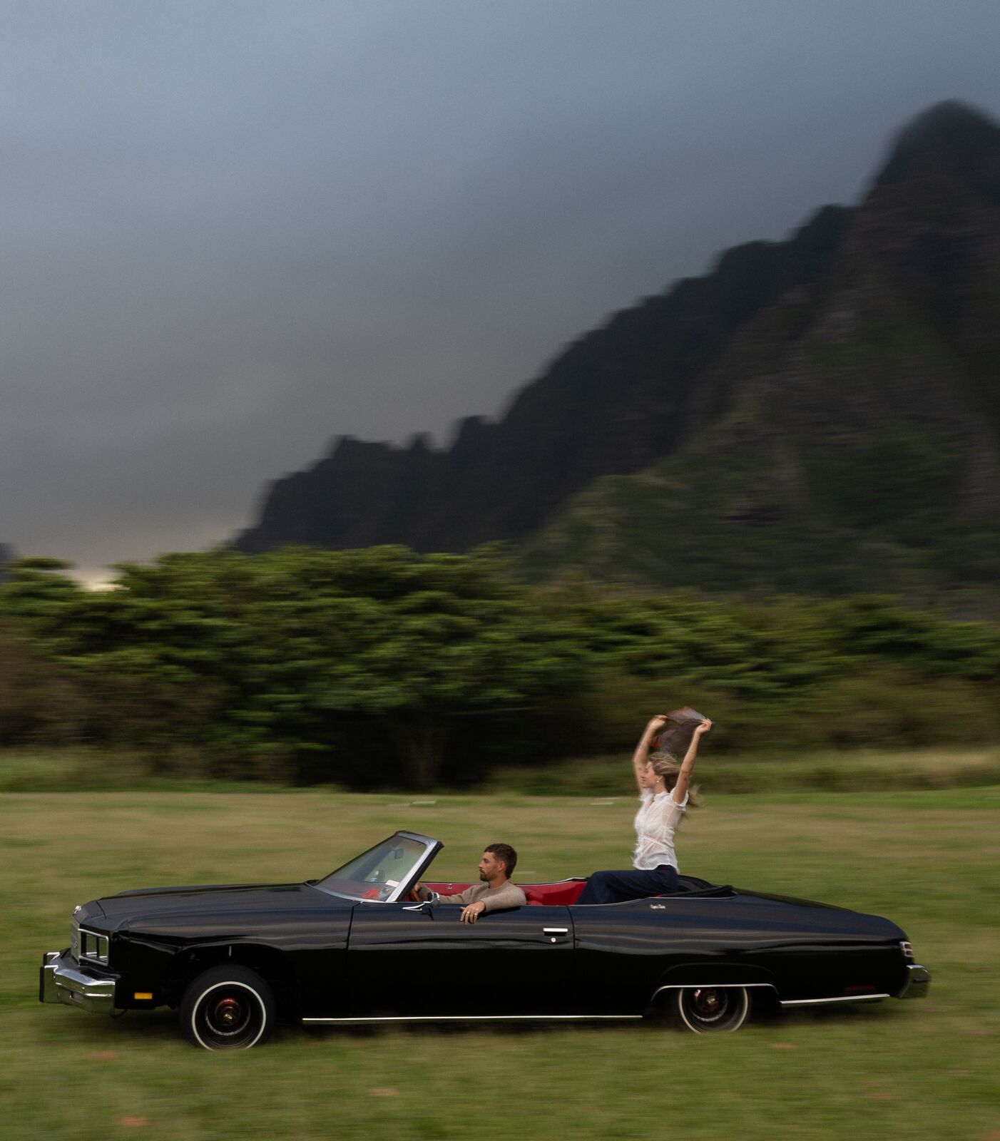 Claire & Jordan — a vintage convertible on a mountain road