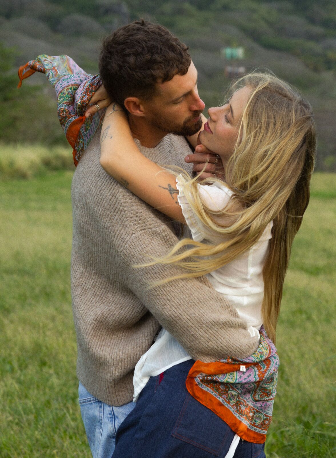 Claire & Jordan — embracing in tall grass