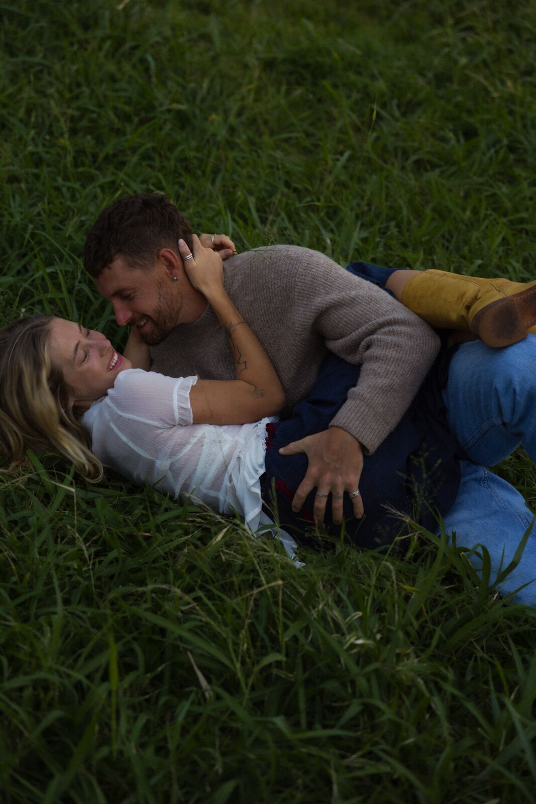Claire & Jordan — laughing together in the grass