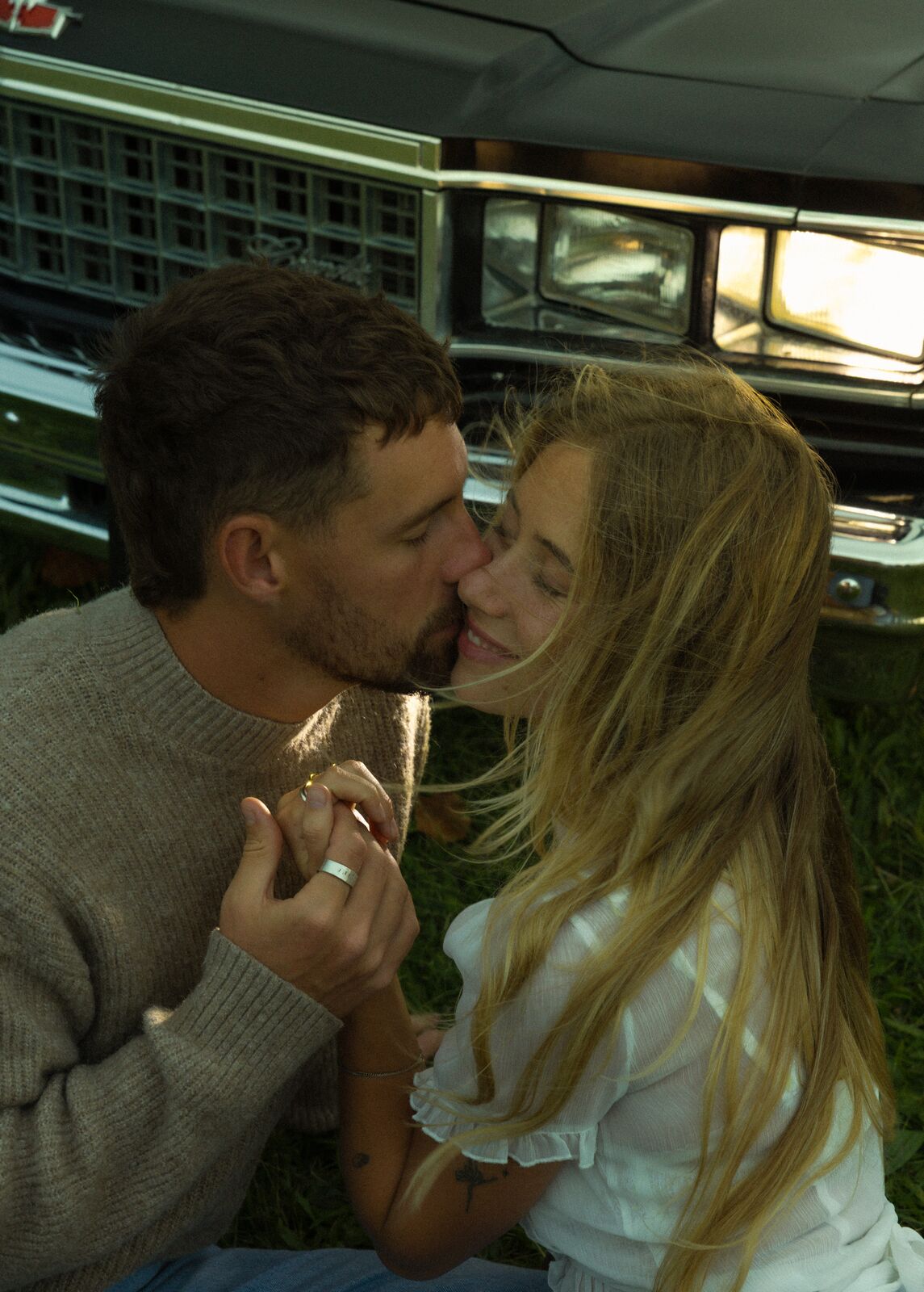 Claire & Jordan — a kiss at the hood of the classic car