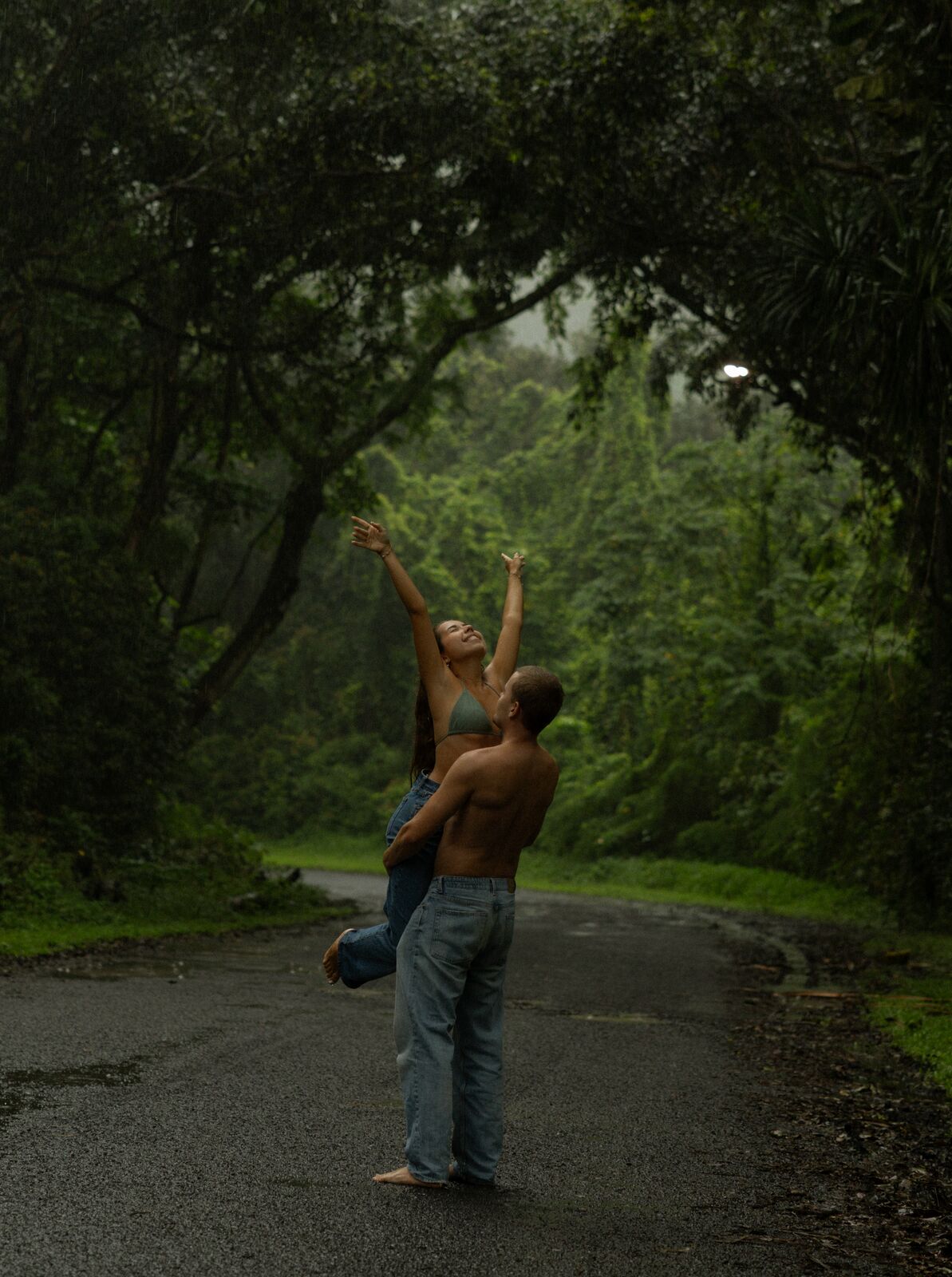 Noa & Mason — a piggyback on the wet road