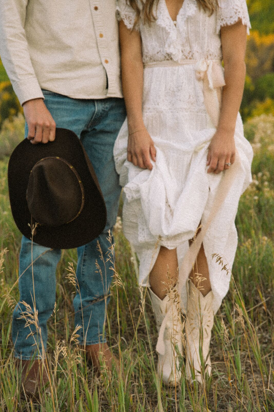 Shannon & Will — a cowboy hat and boots in the meadow